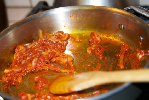 Adding tomato paste to the soffritto