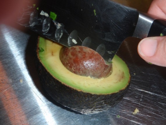 Removing the pit of the avocado