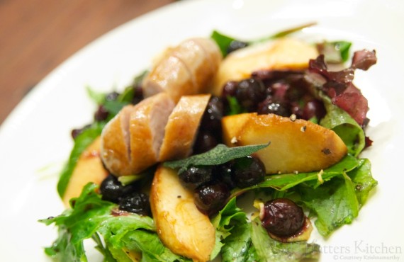 Spring forward salad with blueberries, white peaches, and rabbit sausage